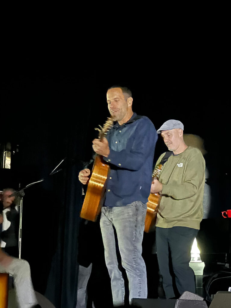 Jack Johnson and friends playing guitar at the Ladero Theatre