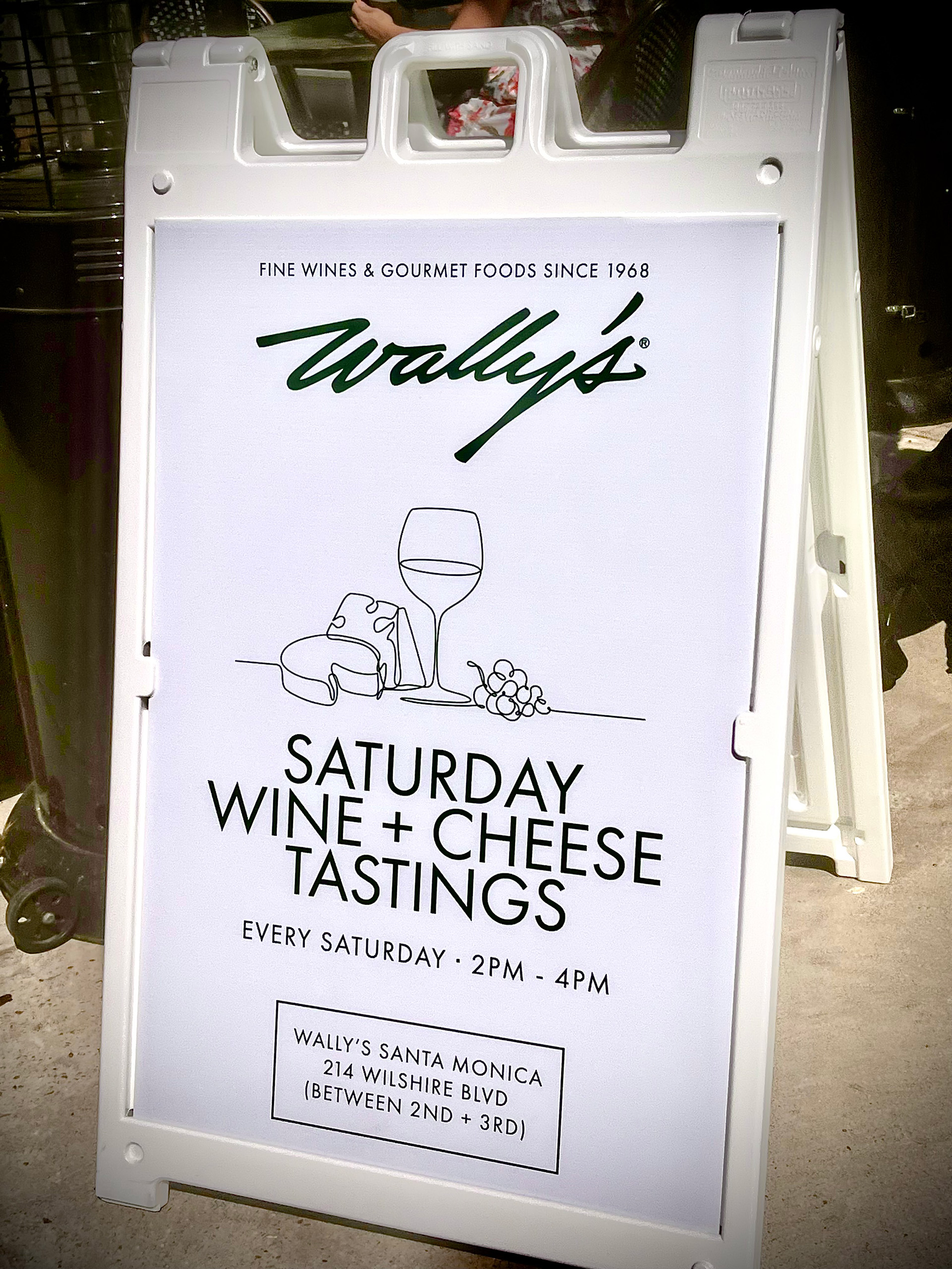 Wally's Wine and Cheese Tastings sign