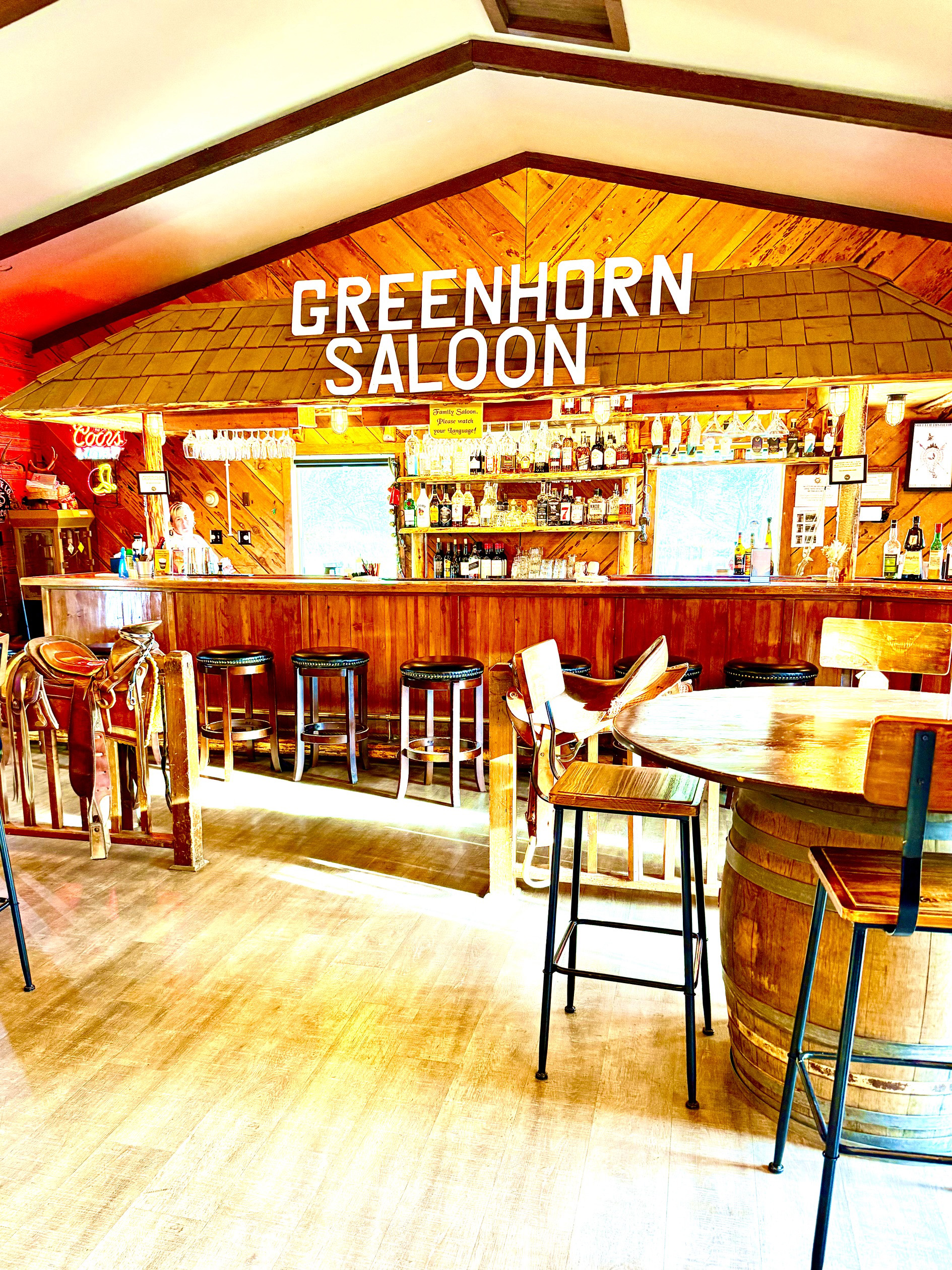Greenhorn Saloon bar and barstools and one table with three chairs