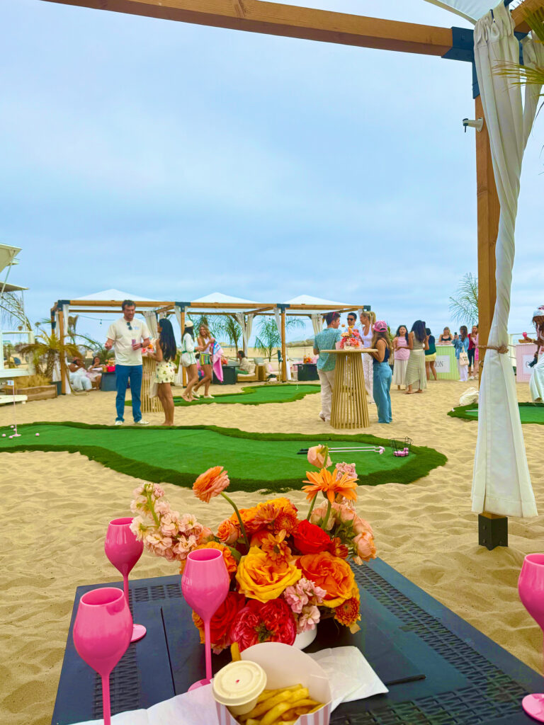 Beach scene with Cabana's, pink wine glasses, flowers and French Fries