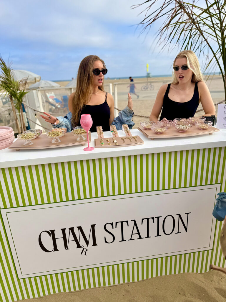 Two Women in front of the Charm Station