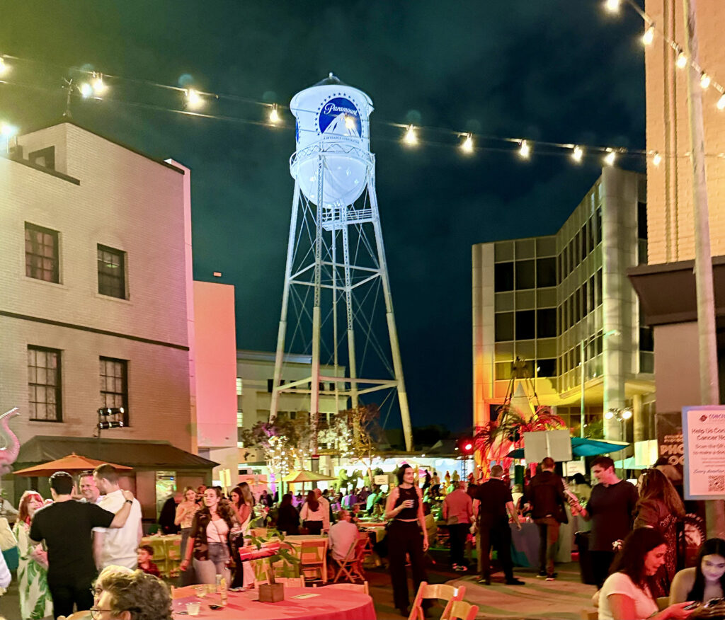 Attendees hanging out on the street set with the Paramount tower in the background