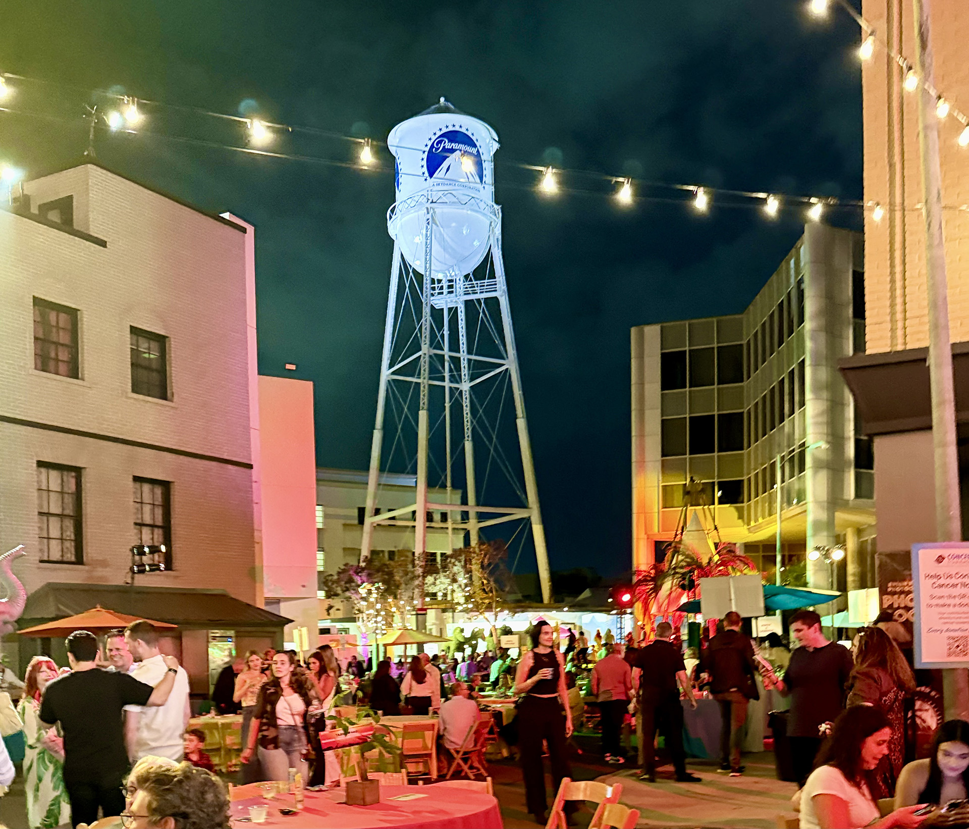 Attendees hanging out on the street set with the Paramount tower in the background