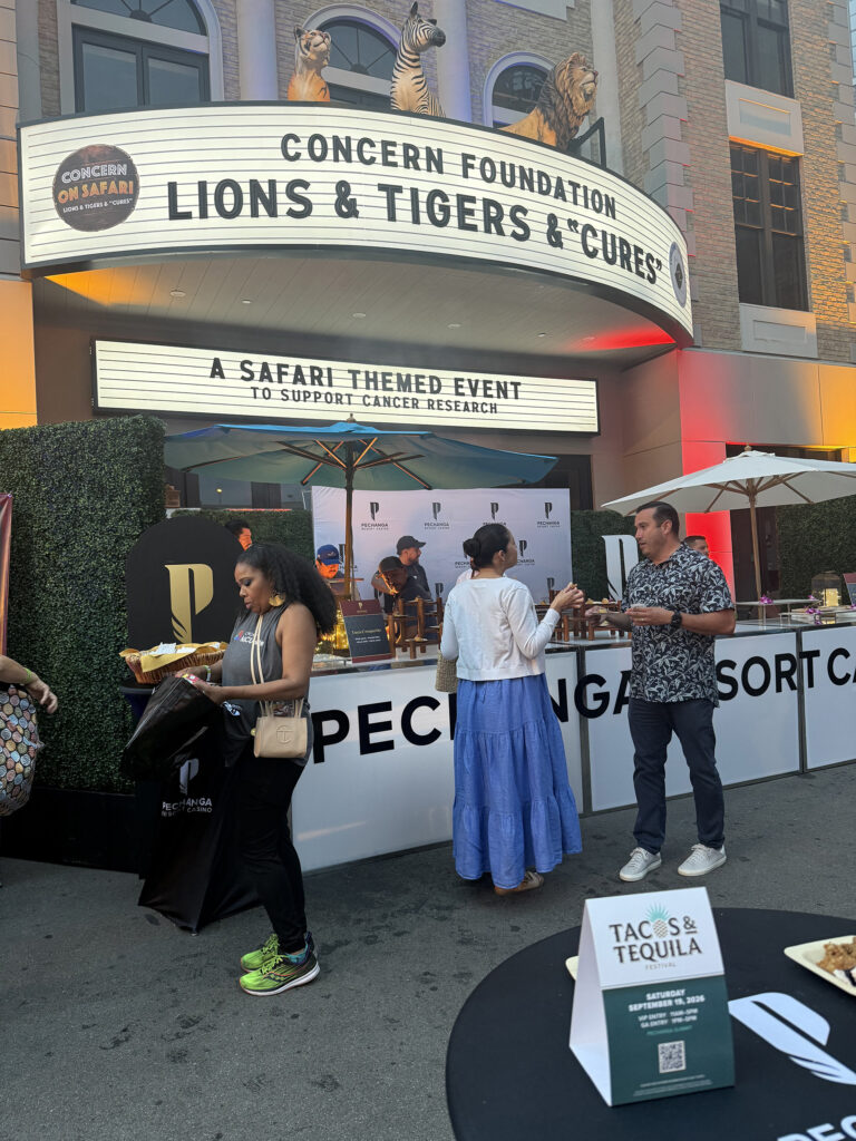 Pechanga Resort Casino setting up a buffet with Concern Foundation Lions & Tigers & Cures on movie marquee